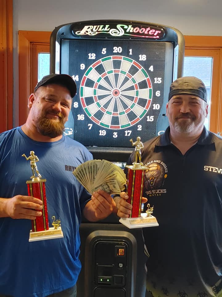 League winners with trophies at Curley's dart boards